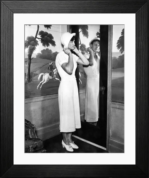 Framed Print : American Olympic athlete Babe Didrikson, (aka Babe Zaharias), (1911-1956), trying on a hat in her hotel room in Chicago, Illinois, 1932
