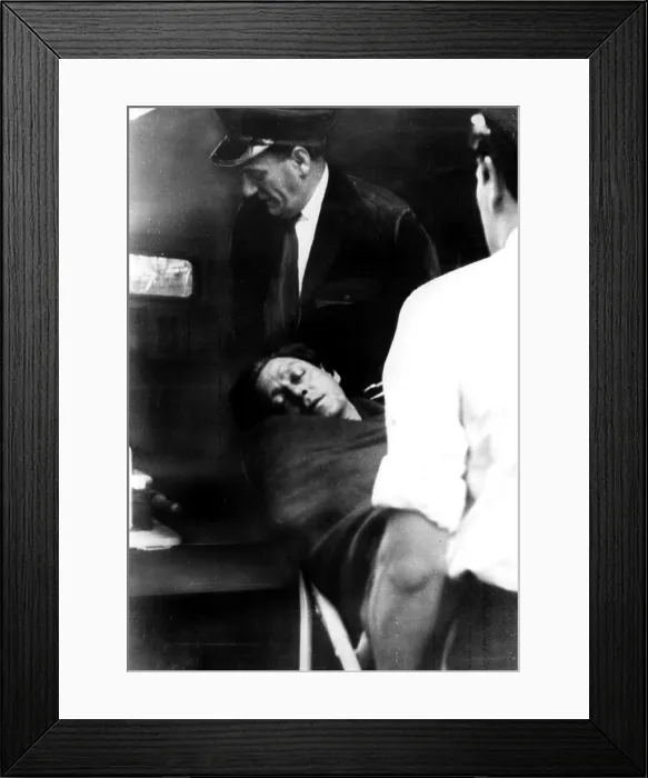 Framed Print : Dr. Stephen Ward being carried from his home to an ambulance after taking an overdose of drugs, just hours before jury deliberations were to begin on vice charges against him