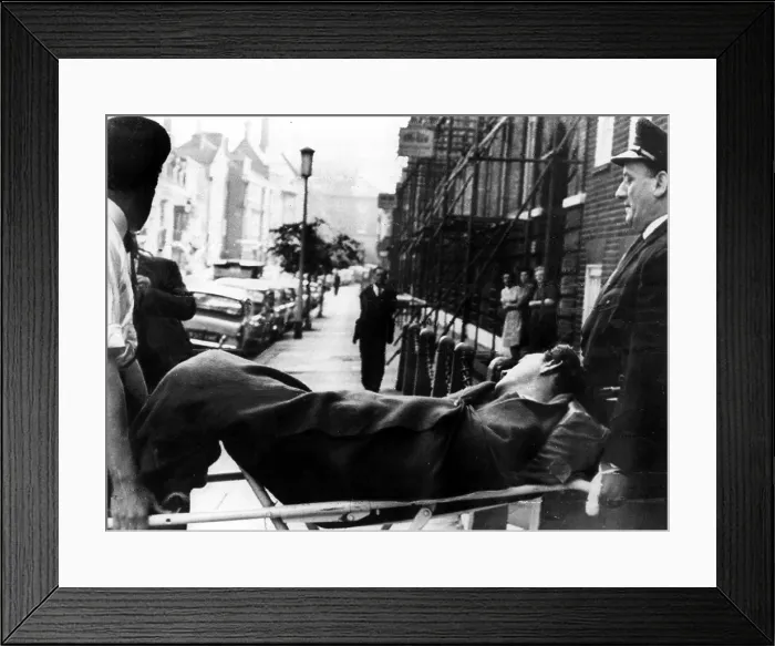 Framed Print : Dr. Stephen Ward being carried from his home to an ambulance after taking an overdose of drugs, just hours before jury deliberations were to begin on vice charges against him