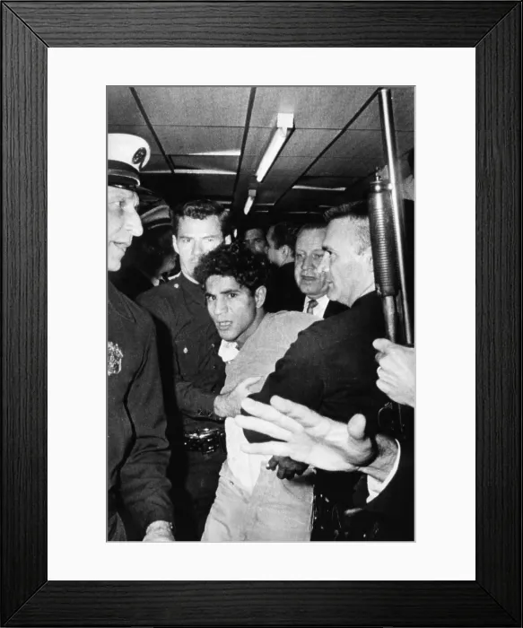 Framed Print : Sirhan Sirhan, the suspect in the shooting of Senator Robert F. Kennedy, being hustled out of the Ambassador Hotel, Los Angeles, California, June 5, 1968 Framed Print : Sirhan Sirhan, the suspect in the shooting of Senator Robert F. Kennedy, being hustled out of the Ambassador Hotel, Los Angeles, California, June 5, 1968