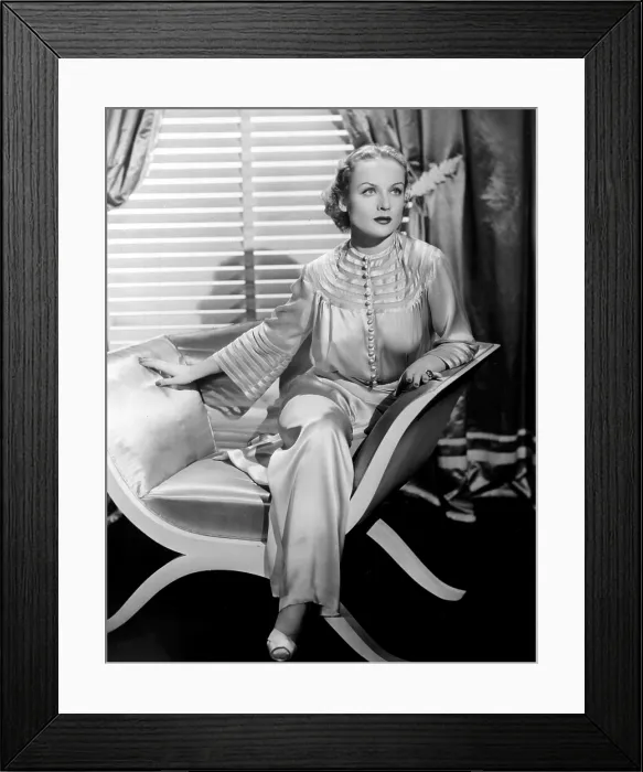 Framed Print : CAROLE LOMBARD, sitting, in a 1930's publicity portrait