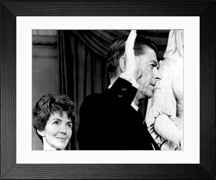 Framed Print : Nancy Reagan watches as Ronald Reagan takes the oath of office as Governor of California, 1 / 2 / 67. Courtesy: CSU Archives  /  Everett Collection
