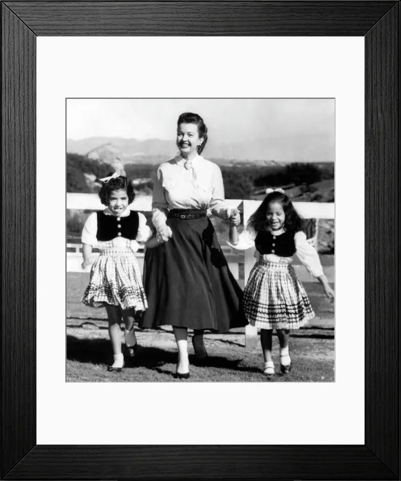 Framed Print : Dale Evans (center), with her two adopted daughters, Deborah Lee (left), Merry Doe (right), circa 1959. Courtesy: CSU Archives / Everett Collection