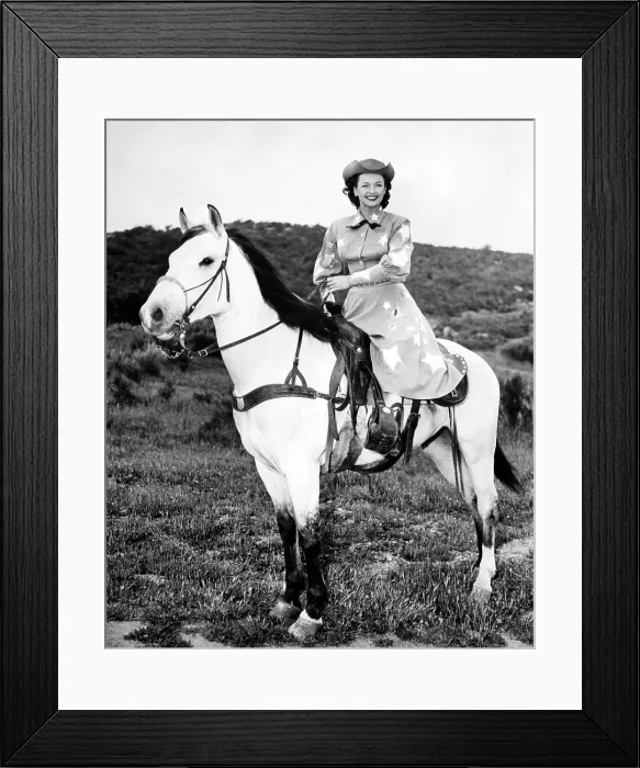 Framed Print : Dale Evans (1912-2001), American actress, singer and wife of Roy Rogers, with her horse Buttermilk, circa 1956. Courtesy: CSU Archives / Everett Collection