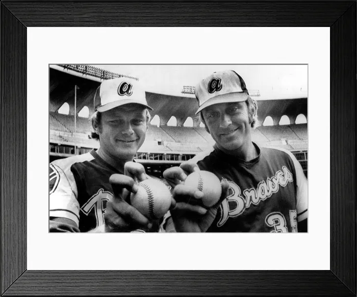 Framed Print : Atlanta Braves pitchers Joe Niekro, Phil Niekro demonstrate their knuckleball grips before a game in St. Louis, 1973. Courtesy: CSU Archives  /  Everett Collection