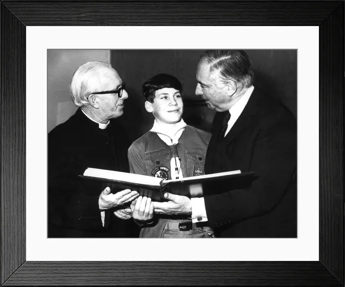 Framed Print : WALTER ANNENBERG, with boy scout Ben Bollinger, and Rev. Martin Sullivan presenting book of American State Emblems to St. Paul's Cathedral in London, Dec. 18, 1969 Framed Print : WALTER ANNENBERG, with boy scout Ben Bollinger, and Rev. Martin Sullivan presenting book of American State Emblems to St. Paul's Cathedral in London, Dec. 18, 1969
