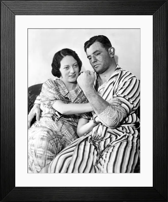 Framed Print : James Braddock shows off to wife May the left that confounded Max Baer and won him the Championship. Mayflower Hotel, NY, NY, June 15, 1935 Framed Print : James Braddock shows off to wife May the left that confounded Max Baer and won him the Championship. Mayflower Hotel, NY, NY, June 15, 1935