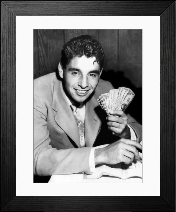 Framed Print : National amateur tennis champion Richard Pancho Gonzales holds money after signing a 1-year contract to tour professionaly. September 20, 1949