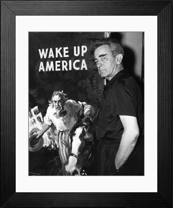 Framed Print : American artist and cartoonist James Montgomery Flagg stands next to his poster for the Wake Up America Committee, in his New York Studio. August 16, 1940 Framed Print : American artist and cartoonist James Montgomery Flagg stands next to his poster for the Wake Up America Committee, in his New York Studio. August 16, 1940