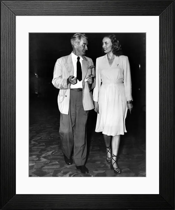 Framed Print : American artist and cartoonist James Montgomery Flagg and model Irene Chrisdie attend the premiere of BAMBI at Radio City Music Hall, New York, New York