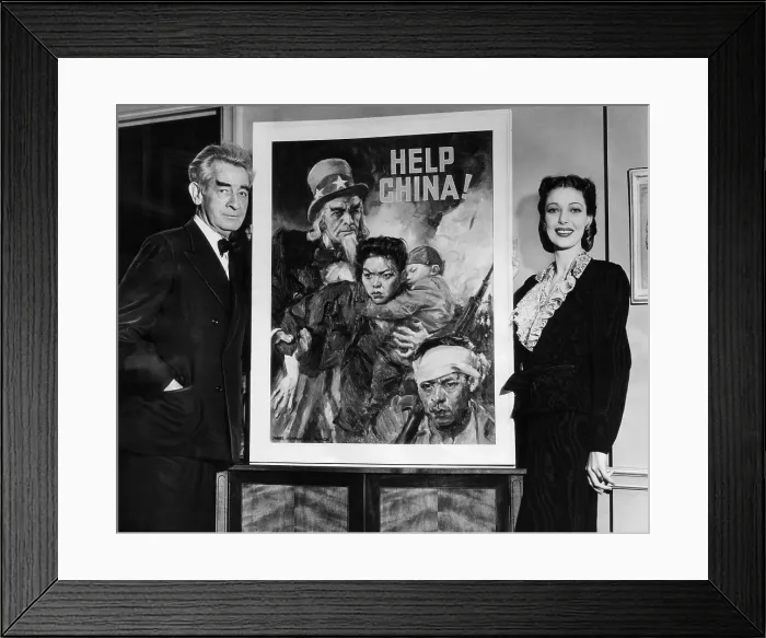 Framed Print : American artist and cartoonist James Montgomery Flagg and actress Loretta Young, beside the poster he created for the United China Relief Campaign. ca