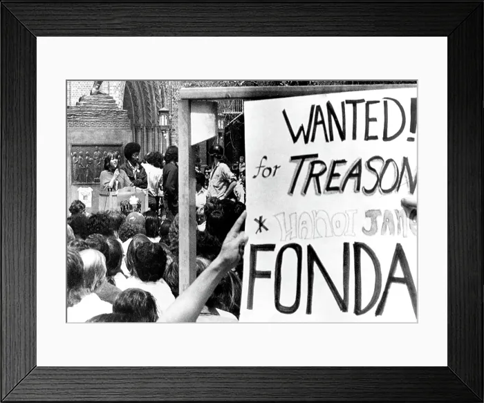 Framed Print : Jane Fonda (left), students holding anti-Jane Fonda sign while Fonda addresses students on the campus of Univ. of Southern California, Los Angeles, April 12, 1973 Framed Print : Jane Fonda (left), students holding anti-Jane Fonda sign while Fonda addresses students on the campus of Univ. of Southern California, Los Angeles, April 12, 1973