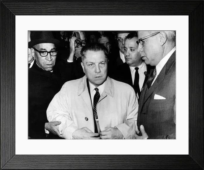 Framed Print : Jimmy Hoffa, surrounded by attorneys and newsmen, arrives at federal court in Washington DC to surrender and begin a prison term for jury tampering. March 7, 1967