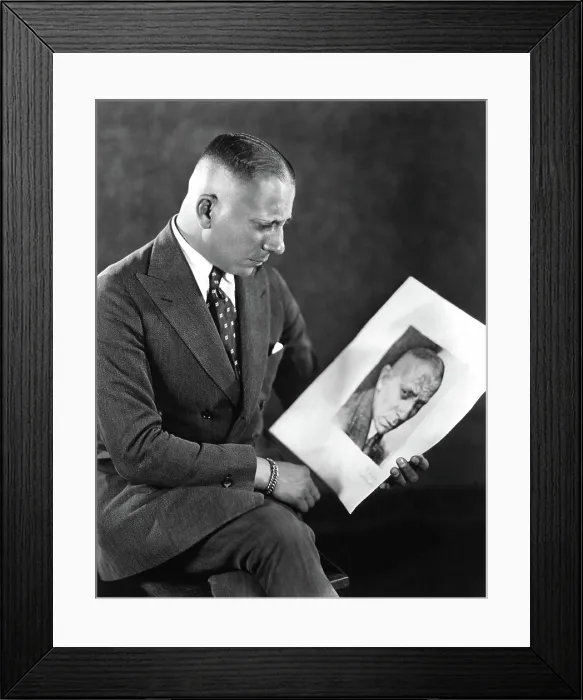 Framed Print : Erich von Stroheim looking at a picture of himself, 1924