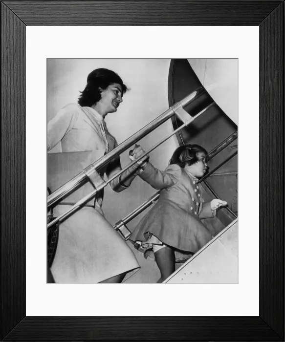 Framed Print : Jacqueline Kennedy, Caroline Kennedy, boarding the Kennedys private plane for an Easter vacation in Palm Beach, Florida. March 27, 1961