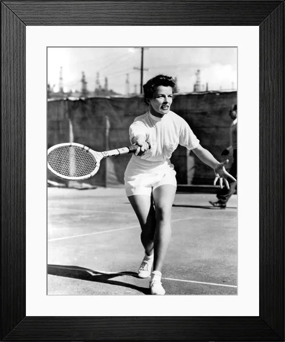 Framed Print : PAT AND MIKE, Katharine Hepburn playing tennis on the set, 1952