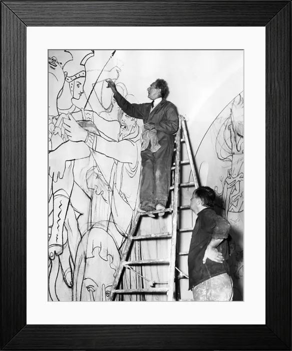 Framed Print : Jean Cocteau works on the mural of the life of St. Peter in St. Peter's Chapel, Villefranche, France. Painter Jean Paul Brusset watches, 1956