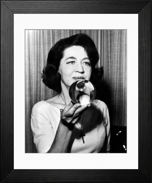 Framed Print : Astrologer and psychic Jeane Dixon holding a crystal ball. Courtesy: CSU Archives / Everett Collection
