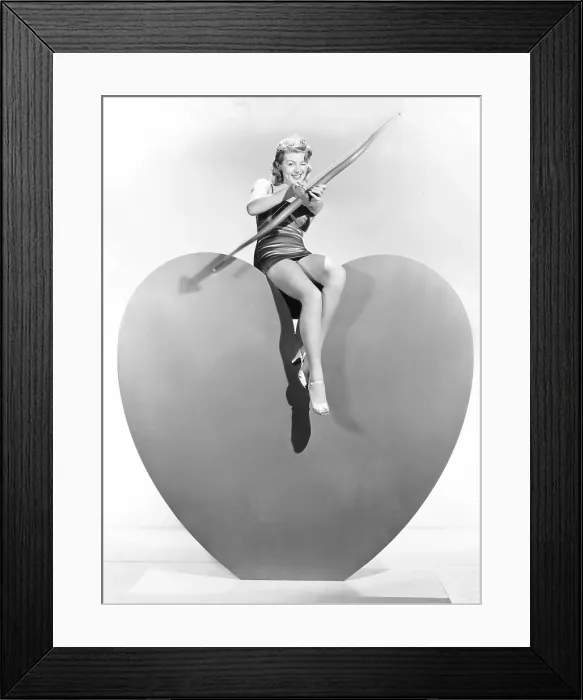 Framed Print : Lana Turner aims Valentine greetings, ca. 1940 Framed Print : Lana Turner aims Valentine greetings, ca. 1940