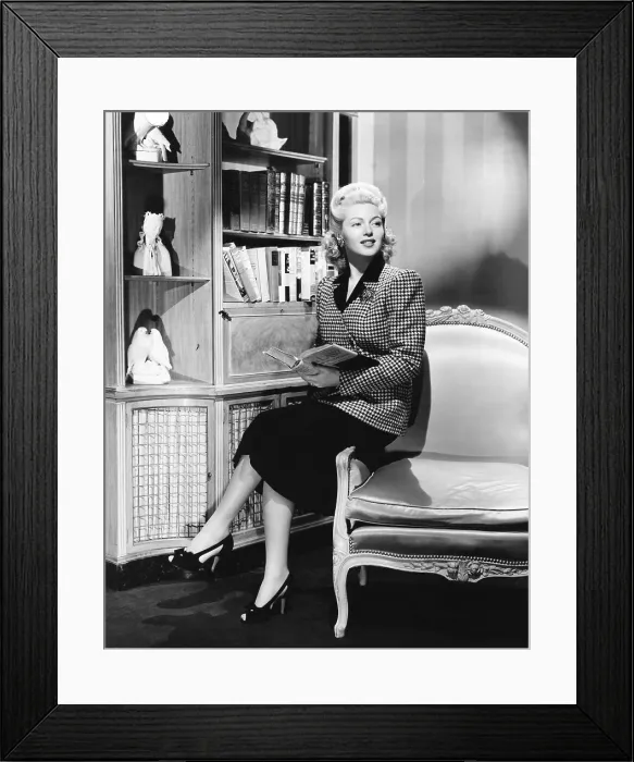 Framed Print : Lana Turner in double breasted collarless jacket, 1941