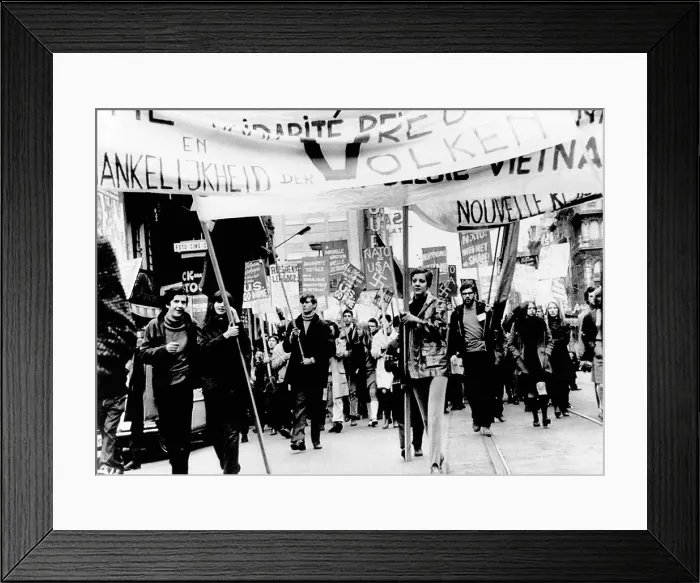 Framed Print : Belgium demonstrators march toward the Brussels Hilton Hotel, to protest the good will visit of President Richard Nixon. Feb. 23, 1969