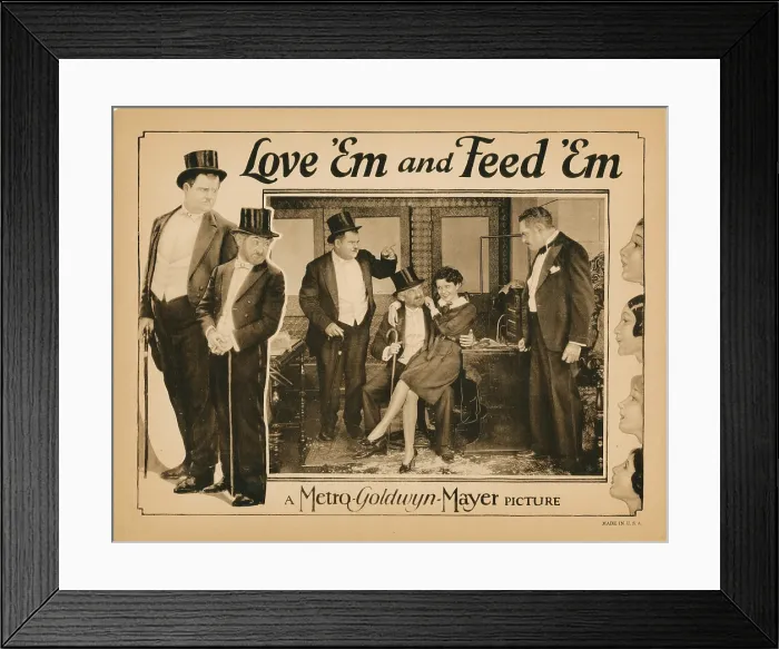 Framed Print : LOVE EM AND FEED EM, lobbycard, Oliver Hardy (left, and pointing), Max Davidson (beard), Viola Richard (sitting on lap), 1927