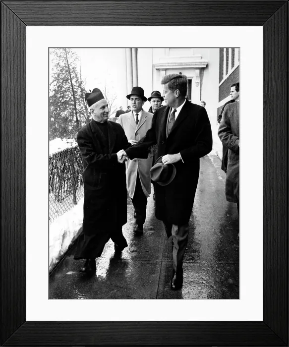 Framed Print : President-elect John F. Kennedy shakes hands with Father Richard J. Casey, the pastor, after attending Mass at Holy Trinity Church prior to inauguration ceremonies