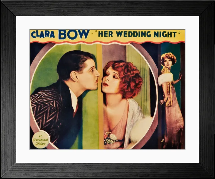 Framed Print : HER WEDDING NIGHT, l-r: Ralph Forbes, Clara Bow on lobbycard, 1930