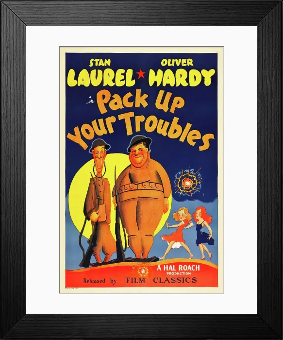 Framed Print : PACK UP YOUR TROUBLES, from left: Stan Laurel, Oliver Hardy on 1940s poster art, 1932