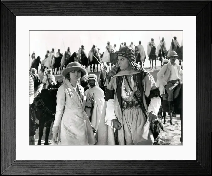 Framed Print : THE SHEIK, from left, Agnes Ayres, Rudolph Valentino, (background, right, Adolphe Menjou), 1921