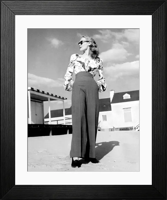 Framed Print : 1940s Fashion: a peasant top with blousson sleeves and a tropical floral pattern with high-waisted pants, 1945.. Courtesy: CSU Archives / Everett Collection Framed Print : 1940s Fashion: a peasant top with blousson sleeves and a tropical floral pattern with high-waisted pants, 1945.. Courtesy: CSU Archives / Everett Collection