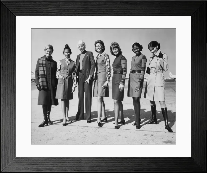 Framed Print : United Airlines stewardesses modeling their latest uniforms, designed by Hollywood couturier Jean Louis, circa early 1970s. Courtesy: CSU Archives / Everett Collection Framed Print : United Airlines stewardesses modeling their latest uniforms, designed by Hollywood couturier Jean Louis, circa early 1970s. Courtesy: CSU Archives / Everett Collection