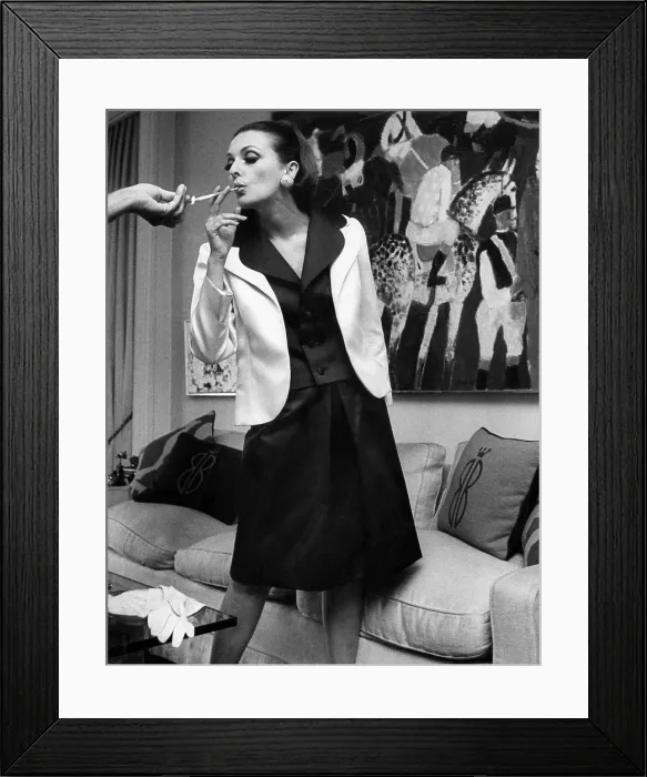 Framed Print : A woman modeling Bill Blass fashion, with Bill Blass logo throw pillows on the couch, circa 1964. Photo: Courtesy: CSU Archives / Everett Collection Framed Print : A woman modeling Bill Blass fashion, with Bill Blass logo throw pillows on the couch, circa 1964. Photo: Courtesy: CSU Archives / Everett Collection