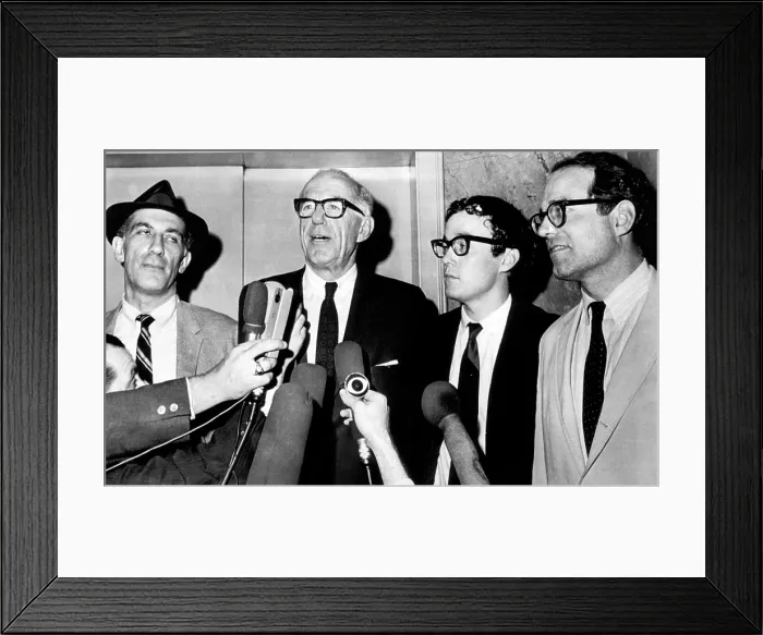 Framed Print : Dr. Benjamin Spock (second from left), American pediatrician and author, talks to newsmen after convicted by a Federal jury of conspiring to counsel young men to evade the draft