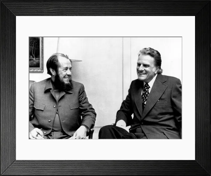 Framed Print : Soviet author Alexander Solzhenitsyn and evangelist Billy Graham discuss world religious trends suring a metting in Stockholm, Sweden. December 1974 Framed Print : Soviet author Alexander Solzhenitsyn and evangelist Billy Graham discuss world religious trends suring a metting in Stockholm, Sweden. December 1974