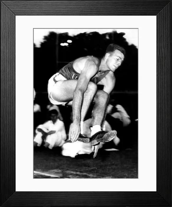 Framed Print : BOB MATHIAS ('Boy Wonder'), makes best broad jump of his career at 23ft 3 3 / 8 inches at 32nd National AAU Decathlon, Tulane, Calif