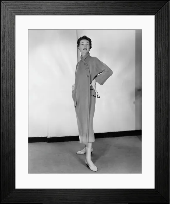 Framed Print : A woman models a camel fleece coat designed by Claire McCardell, circa 1953. Courtesy: CSU Archives / Everett Collection