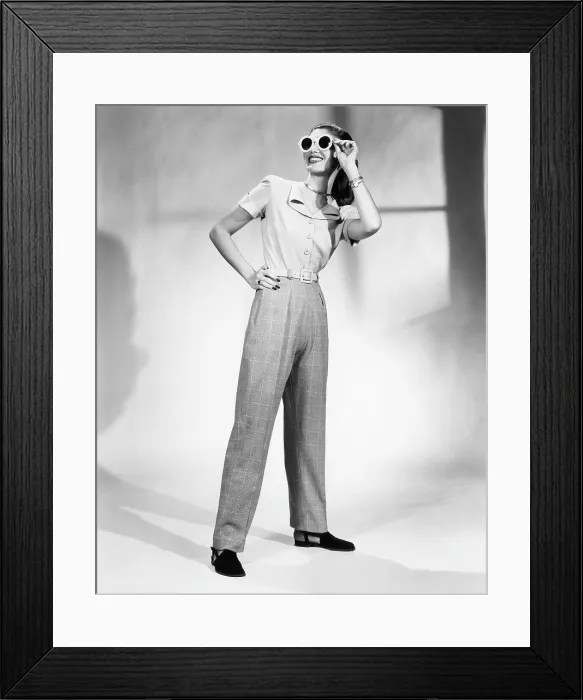 Framed Print : A model wears a pair of slacks designed by Claire Potter, circa 1947. Photo: CSU Archives / Everett Collection