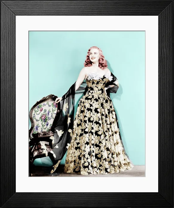 Framed Print : Deanna Durbin in flowered strapless evening dress designed by Howard Greer, 1946