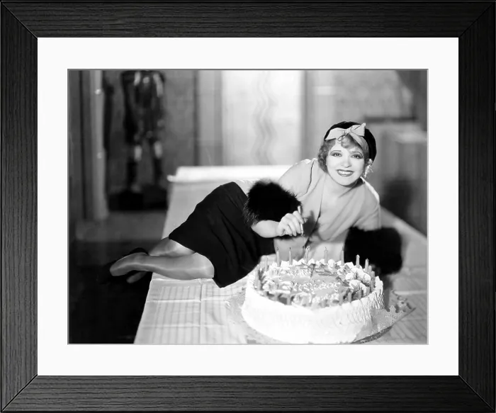 Framed Print : Clara Bow, celebrating her 25th birthday on the set of HER WEDDING NIGHT, July 1930