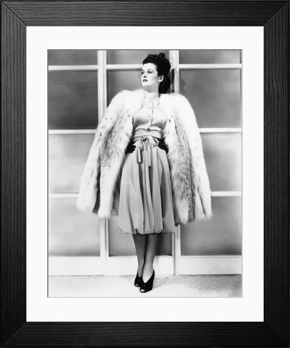 Framed Print : SHE KNEW ALL THE ANSWERS, Joan Bennett in daytime ensemble from I. Magnin with gown designed by Bernard Newman, 1941
