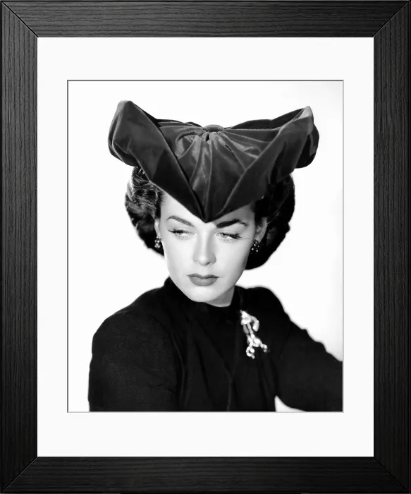 Framed Print : Marguerite Chapman, modeling an ultra chic miracle hat that can be molded into different shapes, ca. early 1940s Framed Print : Marguerite Chapman, modeling an ultra chic miracle hat that can be molded into different shapes, ca. early 1940s