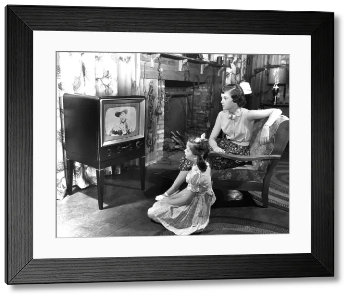 Framed Print : EV1908 - Family watching television, circa 1950s. Courtesy: CSU Archives / Everett Collection Framed Print : EV1908 - Family watching television, circa 1950s. Courtesy: CSU Archives / Everett Collection