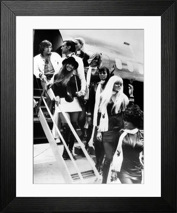 Framed Print : Roman Polanski, Hugh Hefner, Barbi Benton and a group of Playboy bunnies arriving in Paris, France, August 21, 1970. Courtesy CSU Archives / Everett Collection