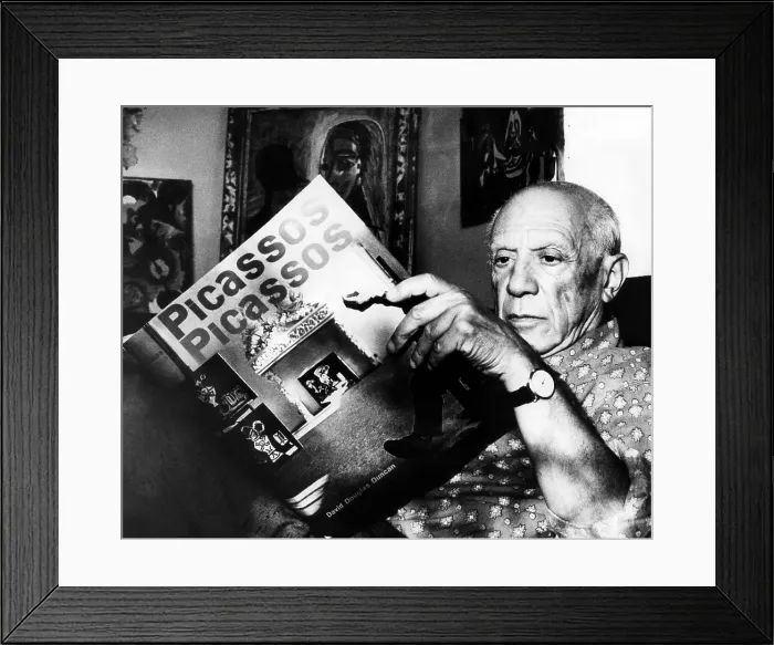 Framed Print : Artist Pablo Picasso reads fom his book at his home on the French Riviera. 10 / 19 / 60. Courtesy: CSU Archives / Everett Collection Framed Print : Artist Pablo Picasso reads fom his book at his home on the French Riviera. 10 / 19 / 60. Courtesy: CSU Archives / Everett Collection