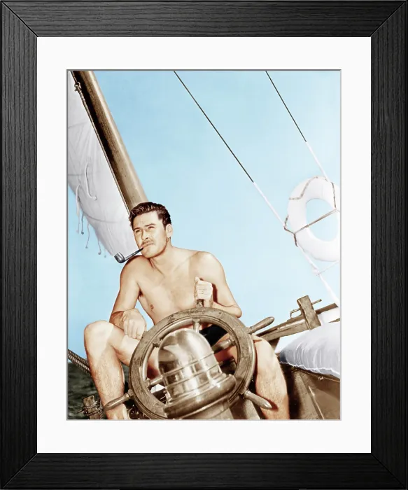 Framed Print : Errol Flynn relaxing on his yacht, ca. 1937 Framed Print : Errol Flynn relaxing on his yacht, ca. 1937