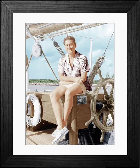 Framed Print : Errol Flynn relaxing on his yacht, ca. early 1940s Framed Print : Errol Flynn relaxing on his yacht, ca. early 1940s