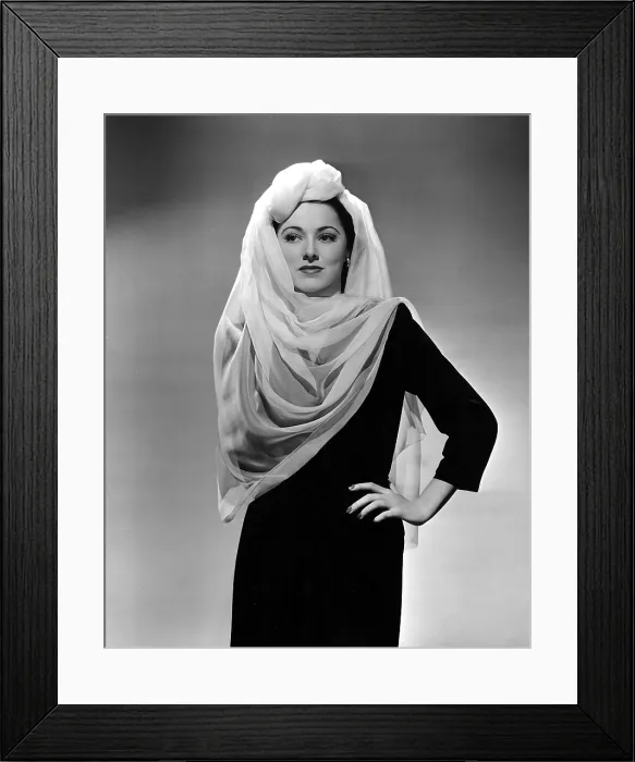 Framed Print : ELEANOR PARKER wearing a turban and scarf treatment made of chiffon, designed by Leah Barnes, 1943