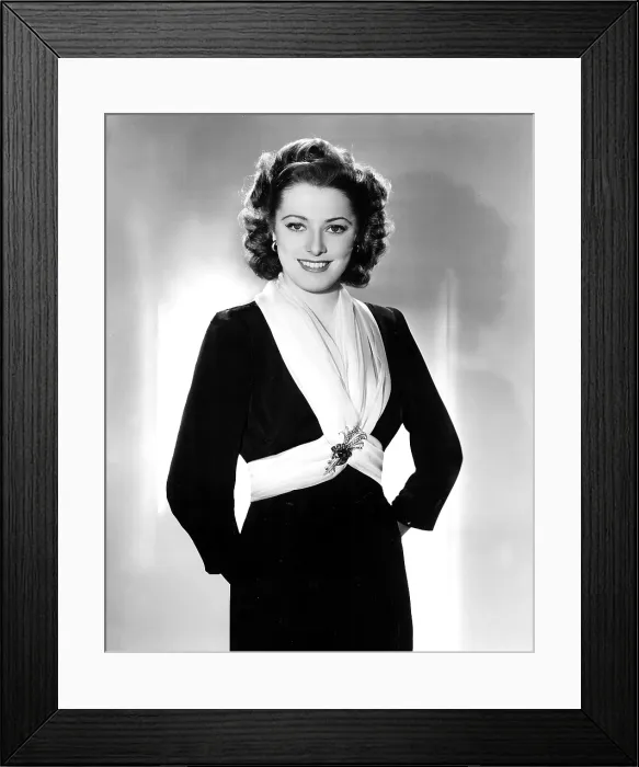 Framed Print : ELEANOR PARKER wearing two yards of chiffon as a scarf, held in place by a large jeweled pin. 1943