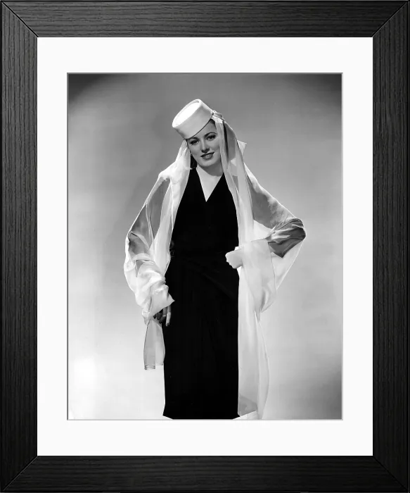 Framed Print : ELEANOR PARKER wearing a pill box hat and chiffon drape. 1943